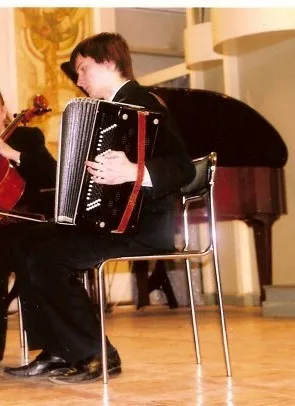 Rost Radchenko is playing button accordion.