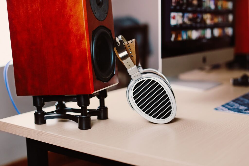 headphones and studio monitor on the table