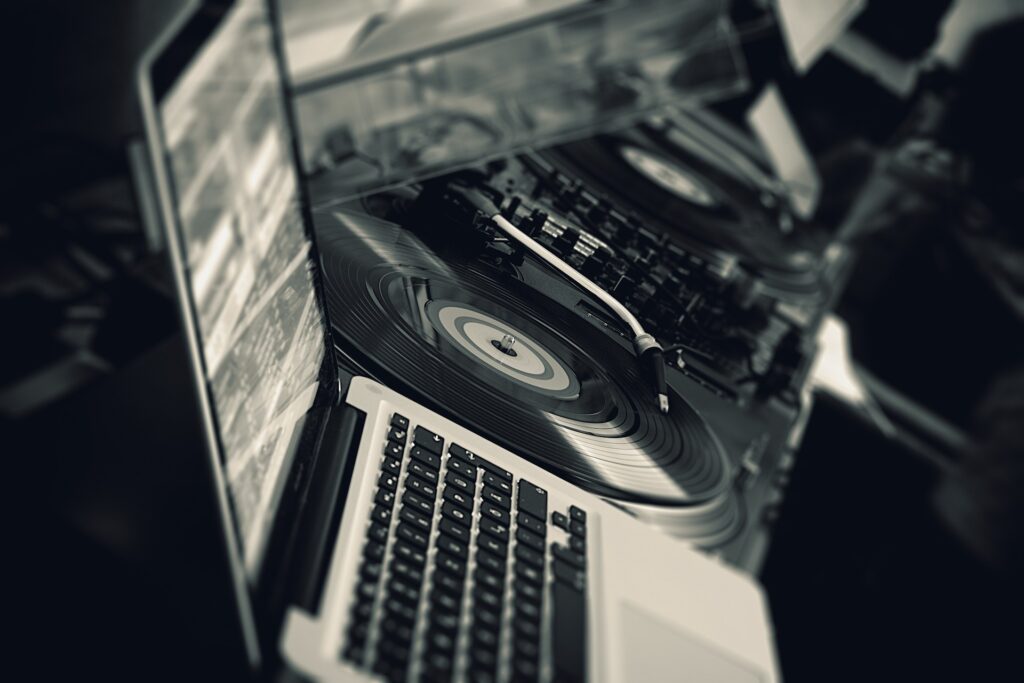 DJ's turntable and laptop with the audio software